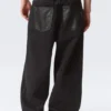 Astro Mid Rise Baggy Faux Leather Pocket Jeans – Black Rinse – Black