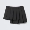 Asymmetric Pleated Wrap Mini Skirt – Black