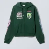 Boxy Graphic Zip Hoodie – Multi-Printed Dark Green