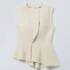 Sleeveless Asymmetric Peplum Top – Ecru